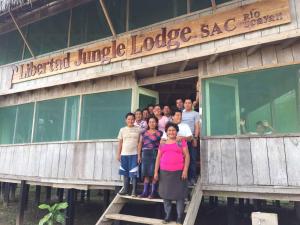 a group of people standing outside of a building at Libertad Jungle Lodge in Yucuruche
