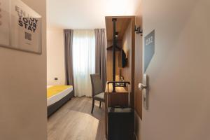Postel nebo postele na pokoji v ubytování Hi Hotels Trento - Wellness & Spa Adults Only