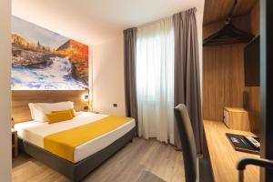 Postel nebo postele na pokoji v ubytování Hi Hotels Trento - Wellness & Spa Adults Only