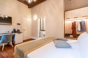 Posteľ alebo postele v izbe v ubytovaní Residenza La Duchessa Deluxe Rooms