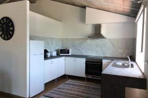 A kitchen or kitchenette at Casa do Largo - Casa Sopra