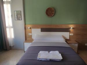 A bed or beds in a room at Habitaciones Barra89