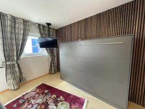 Televisyen dan/atau pusat hiburan di Design Apartment Catch Me If You Can