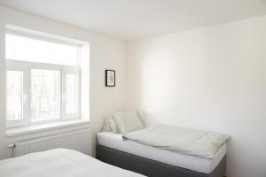 Postel nebo postele na pokoji v ubytování Apartmány Winkler