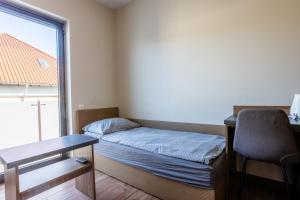 Posteľ alebo postele v izbe v ubytovaní NoclegiJarocin Bed & Breakfast