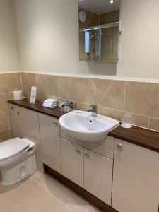 a bathroom with a sink and a toilet at Inverglen Guest House in Inverness