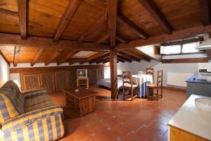 a living room with a couch and a table at APARTAMENTOS LA COTERA - Barrio de CAMBARCO in Cambarco