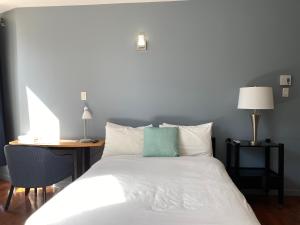 Postel nebo postele na pokoji v ubytování Hotel Belley