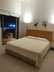 Postel nebo postele na pokoji v ubytování Y & P LATCHI HOTEL