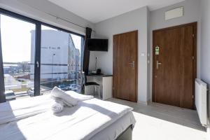 Posteľ alebo postele v izbe v ubytovaní NoclegiJarocin Bed & Breakfast
