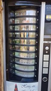 a glass door of an empty wine vending machine at Blockhaus in Kägsdorf