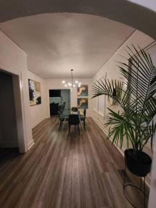 a living room with a table and a potted plant at The Jasmine On Main in Little Rock +12 photos