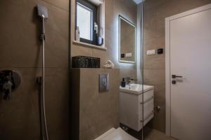 Kúpeľňa v ubytovaní Villa Magna luxury apartments