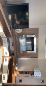 an overhead view of a kitchen with a microwave at Riverside 11 PARKDEAN South Beach Heacham in Heacham