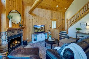 a living room with a couch and a fireplace at Juniper Ridge Chalet at Eagle Crest Resort in Redmond