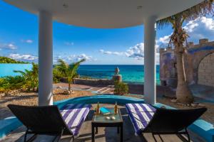 a view of the ocean from the patio of a villa at Casa Cielo 2 Bedroom Oceanfront Villa in Isla Mujeres