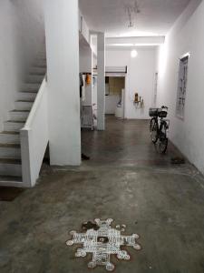 an empty room with a skeleton on the floor at Mayurapriya Inn in Chennai