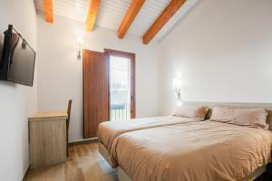 Postel nebo postele na pokoji v ubytování O Trancallo