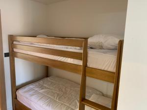 a couple of bunk beds in a room at Appartement design en plein centre du Touquet in Le Touquet-Paris-Plage