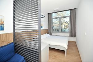 Ліжко або ліжка в номері Rondo Premium Apartments