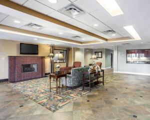 a living room with a couch and a fireplace at Quality Inn Donaldsonville - Gonzales in Donaldsonville