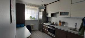 Kuchyňa alebo kuchynka v ubytovaní Apartament Olsztyńska 12