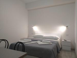 A bed or beds in a room at BERNINI Affittacamere - Guest House
