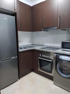 A kitchen or kitchenette at Casa Aurea-Apartamento zona antigua,parking y wifi by DeLabra Apartments