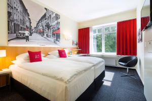 Hotel Wartmann am Bahnhof客房内的一张或多张床位