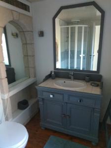 a bathroom with a sink and a mirror at La Terrasse in Mers-les-Bains +10 photos