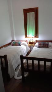 Tempat tidur dalam kamar di Jardines del Acebron