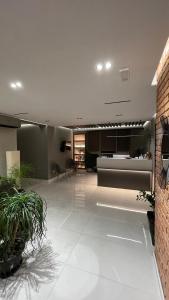 a large living room with a couch and a table at Hotel Oresti Center in Tirana