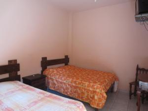 Postel nebo postele na pokoji v ubytování Hotel Quinta San Juan