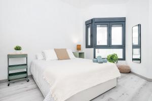 Łóżko lub łóżka w pokoju w obiekcie BHost - La Muralla