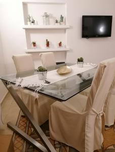 TV a/nebo společenská místnost v ubytování CASA VERDINA, nel cuore di Alghero
