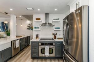 a kitchen with a stainless steel refrigerator at Beach Club 604 in Pensacola Beach