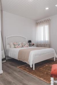 En eller flere senge i et værelse på Casa do Cruzeiro Quinta do Couto