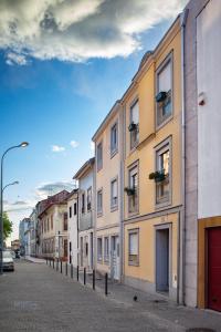 a row of buildings on a city street at Casa Suyay Studio in Aveiro