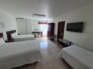 Postel nebo postele na pokoji v ubytování HOTEL FINA INN + 18 fotografií