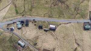 an overhead view of a road with trucks on it at The Real Faroese Experience in Skálavík