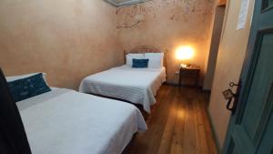 Postel nebo postele na pokoji v ubytování Hotel Ines Maria
