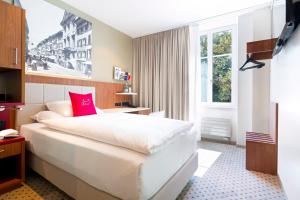 Hotel Wartmann am Bahnhof客房内的一张或多张床位