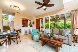 a living room with a couch and a table at Kapalua Bay Vill 23G1 Ocean front 1 BD 1BA villa in Kahana