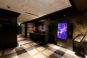 TV a/nebo společenská místnost v ubytování HOTEL555 沼津駅北