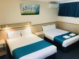 Postel nebo postele na pokoji v ubytování Comfort Inn Glenelg
