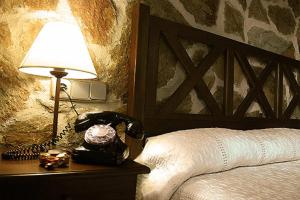 Postel nebo postele na pokoji v ubytování Hotel Spa Villa de Mogarraz