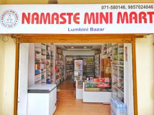 a store with a sign that readsamesmite mini market at Lumbini Garden Lodge in Lumbini