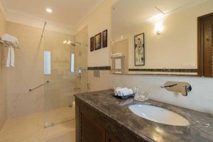a bathroom with a sink and a shower at StayVista at The Winter Line with Complimentary Breakfast in Kasauli