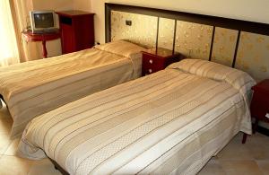 Postel nebo postele na pokoji v ubytování B&B San Marco