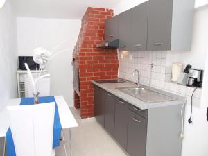 Kuchyň nebo kuchyňský kout v ubytování Villa Grace Felice